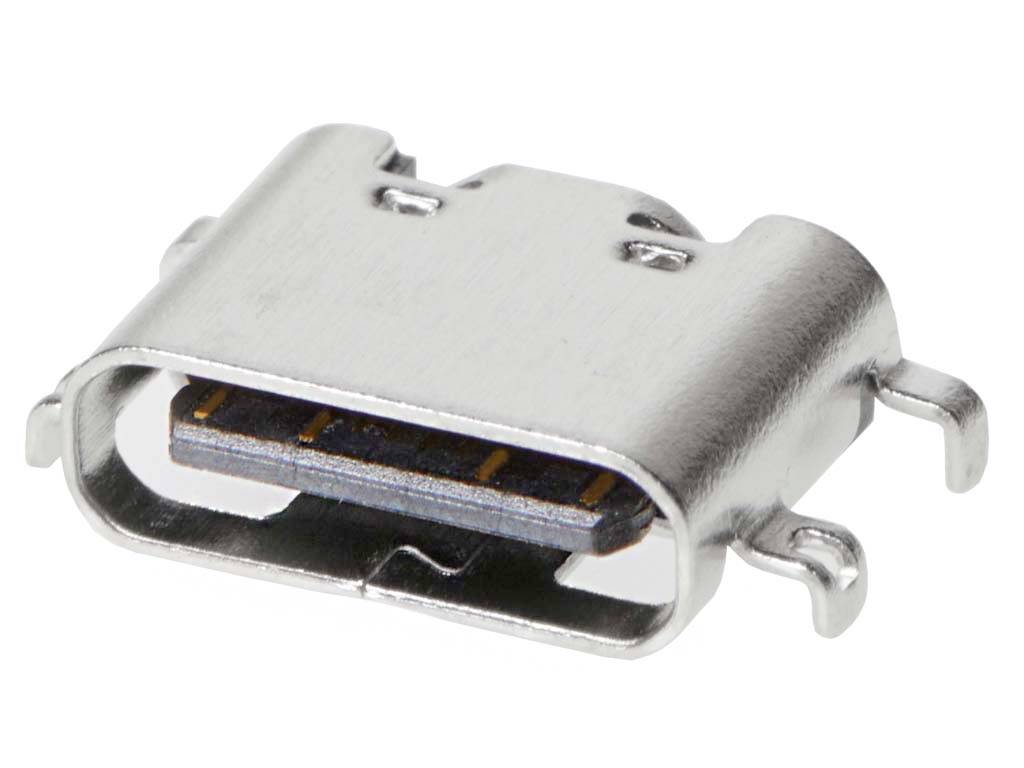 Egy fém USB-C csatlakozó közeli felvételen, amely bemutatja a lapos, ovális formát és a belsejében látható érintkezőpontokat.
