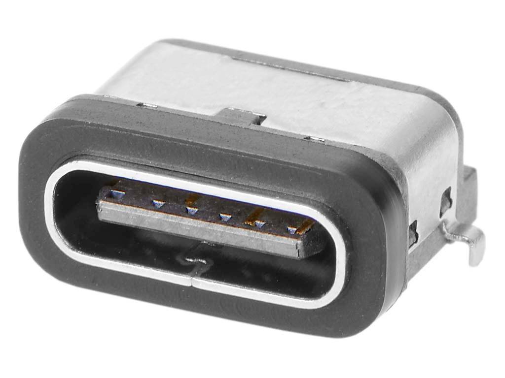 Egy USB-C-csatlakozó közeli felvétele. Látható az ovális csatlakozó lekerekített éllekkel és a belsejében elhelyezkedő érintkezőkkel.