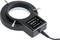 Egy kerek LED-lámpa adapter "ADAPTOR FOR LED LAMP LED-501-B 90-240V 0.3A max" felirattal. Csatlakozókábel a jobb oldalon.