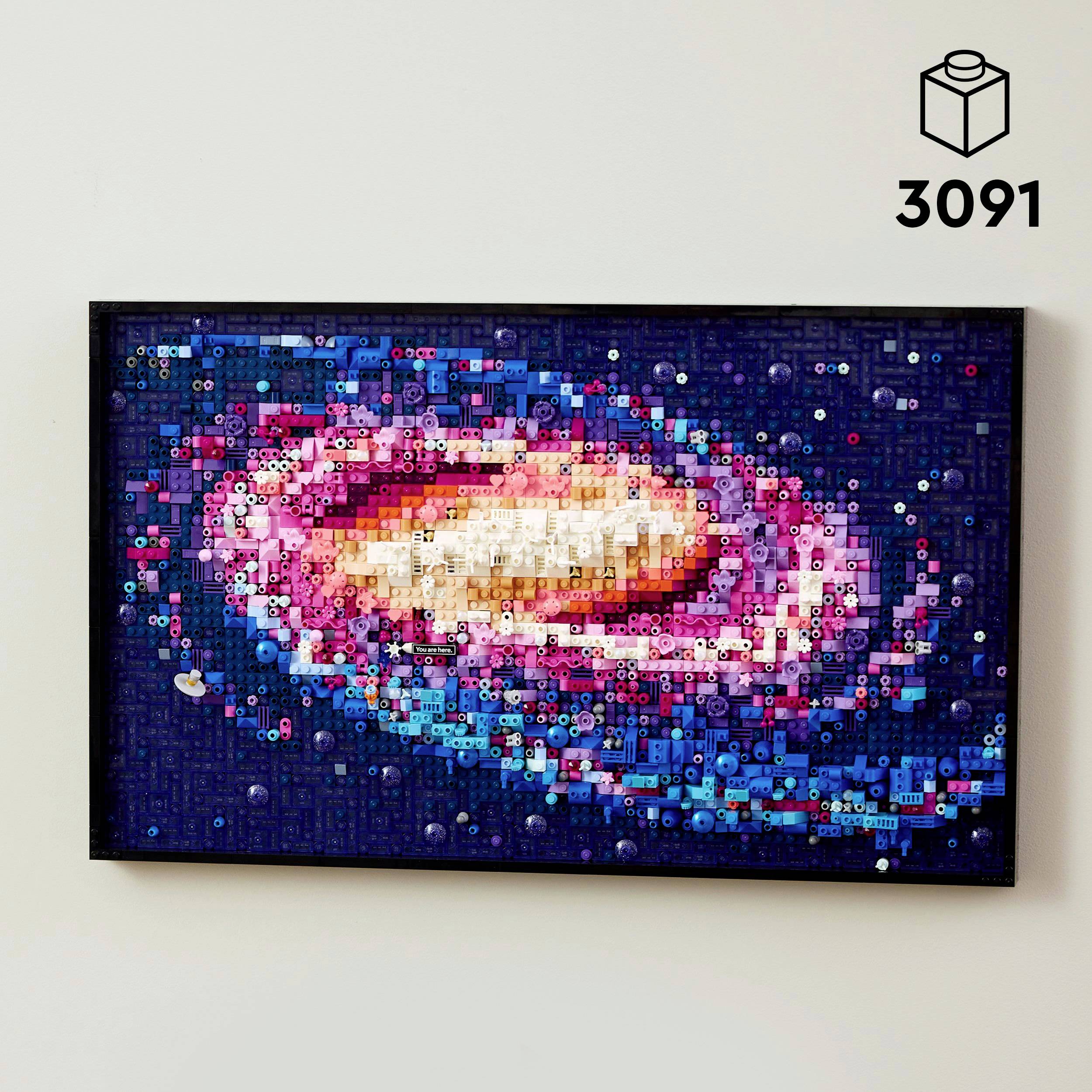 Egy téglalap alakú mozaik egy spirálgalaxist ábrázol tarka pixelekből sötét háttér előtt. Fent jobbra egy '3091'-es doboz látható.