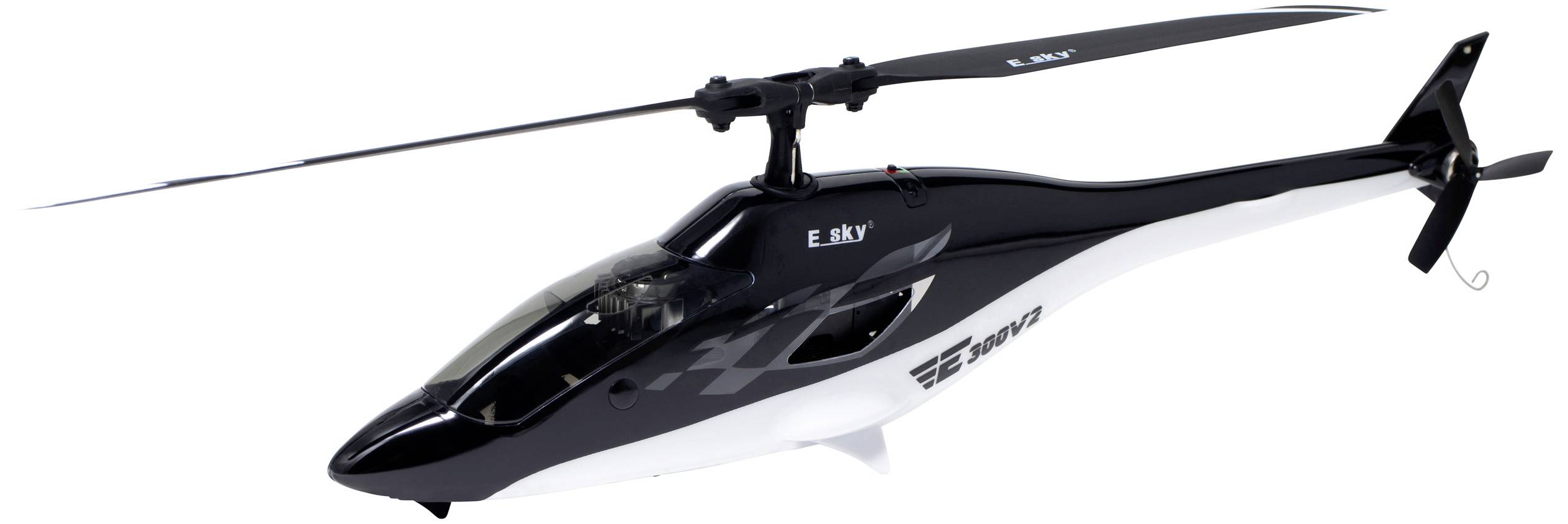 Egy fekete modellhelikopter fehér elemekkel, oldalról felvéve, amint a levegőben repül, mutatja a dizájnt és az arányokat.