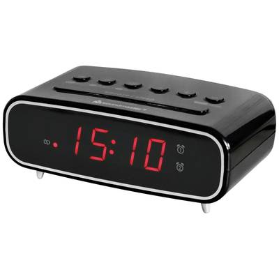 Egy fekete digitális ébresztőóra 15:10-et mutat piros számjegyekkel, amelyet kezelőgombok vesznek körül a tetején.