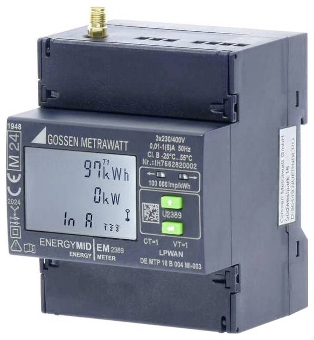 Egy digitális energiamérő '97 kWh', '0 kW' és 'In A' értékeket mutat. A készülék 'ENERGYMID' felirattal rendelkezik, és a Gossen Metrawatt gyártmánya.