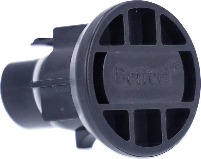 Kerek, fekete műanyag alkatrész több téglalap alakú nyílással az elülső oldalán, valószínűleg egy lefolyó- vagy szelepelem.