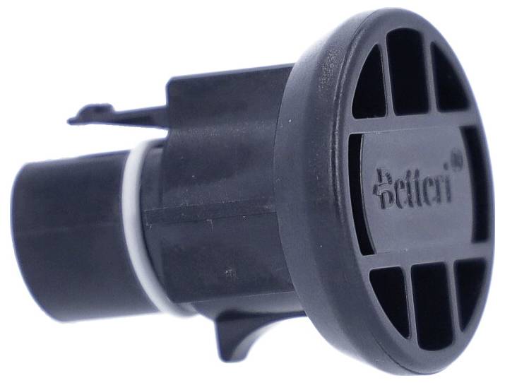 Egy fekete, hengeres autóérzékelő, amelynek tetején rácsmintázat van, rajta a 'Hella' felirattal.