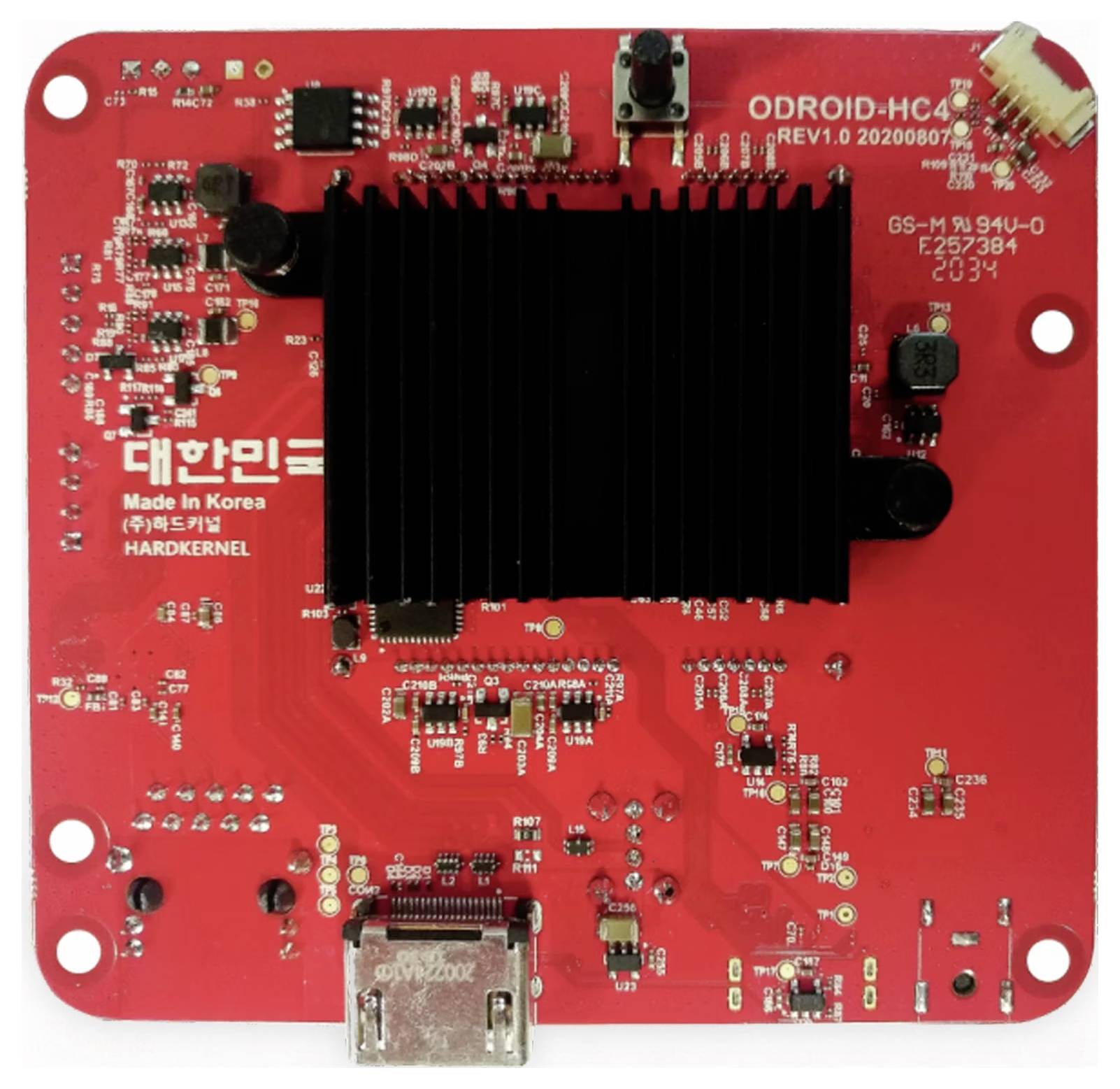 Üres elektronikai áramköri lap hűtőbordával, csatlakozókkal és alkatrészekkel. Felirat: 'HARDKERNEL', 'ODROID-HC4'.