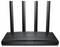 Négy antennás, fekete WLAN-router elülső oldali világító jelzőfényekkel, fehér háttér előtt.