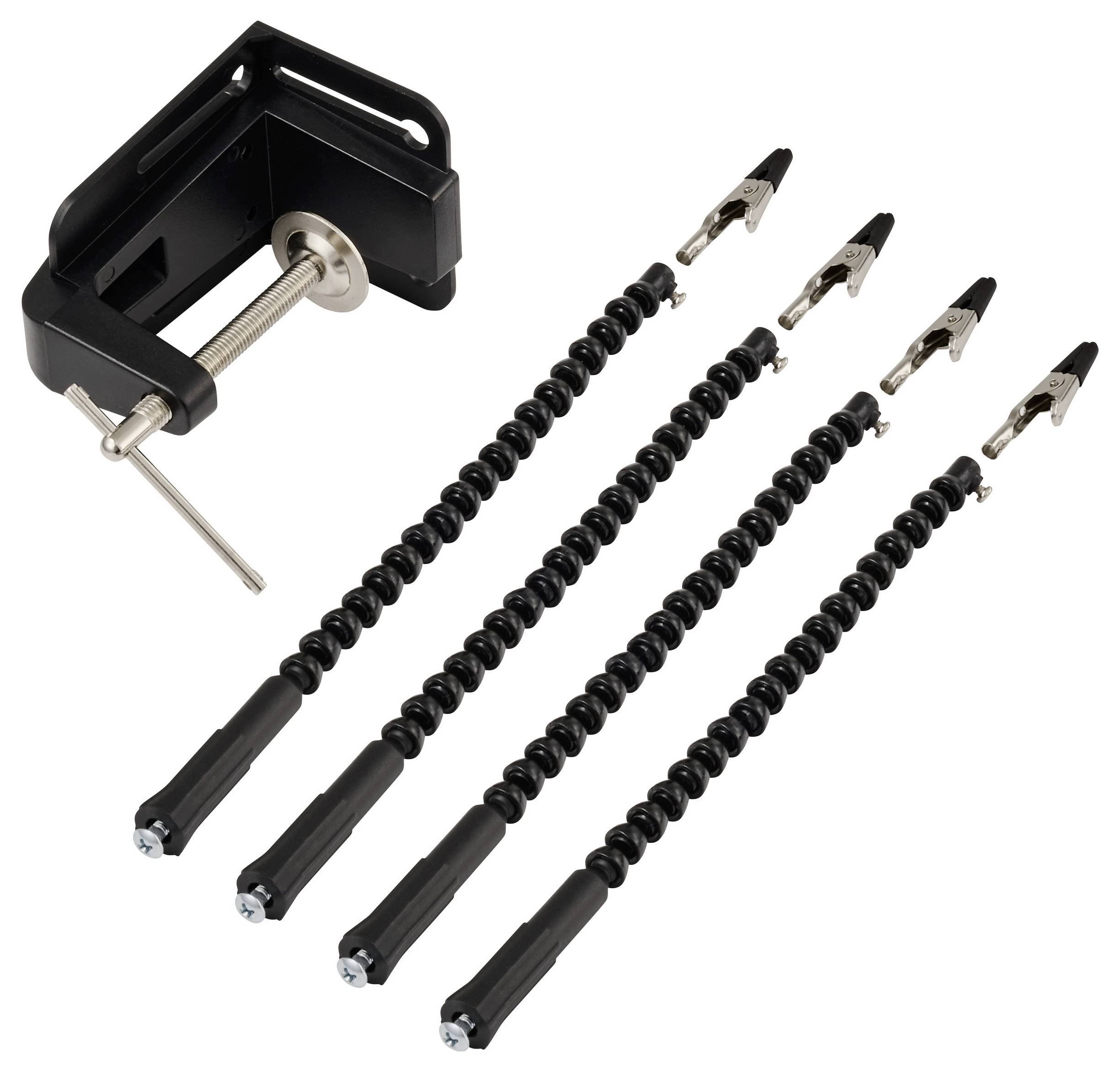 Négy darab fekete spirál gitár kapocsszorító és egy fekete gitár híd tűszedő, amelyet valószínűleg húrcsere vagy hangszerkarbantartás során használnak.