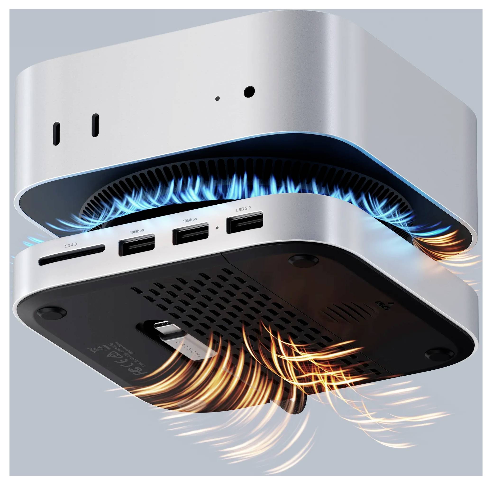 Egy kompakt fémszerkezet szellőzőnyílásokkal az oldalán és az alján, kék fénnyel világító részletekkel, amely a hűtési légáramlást jelzi. Csatlakozók láthatók az egyik oldalán.