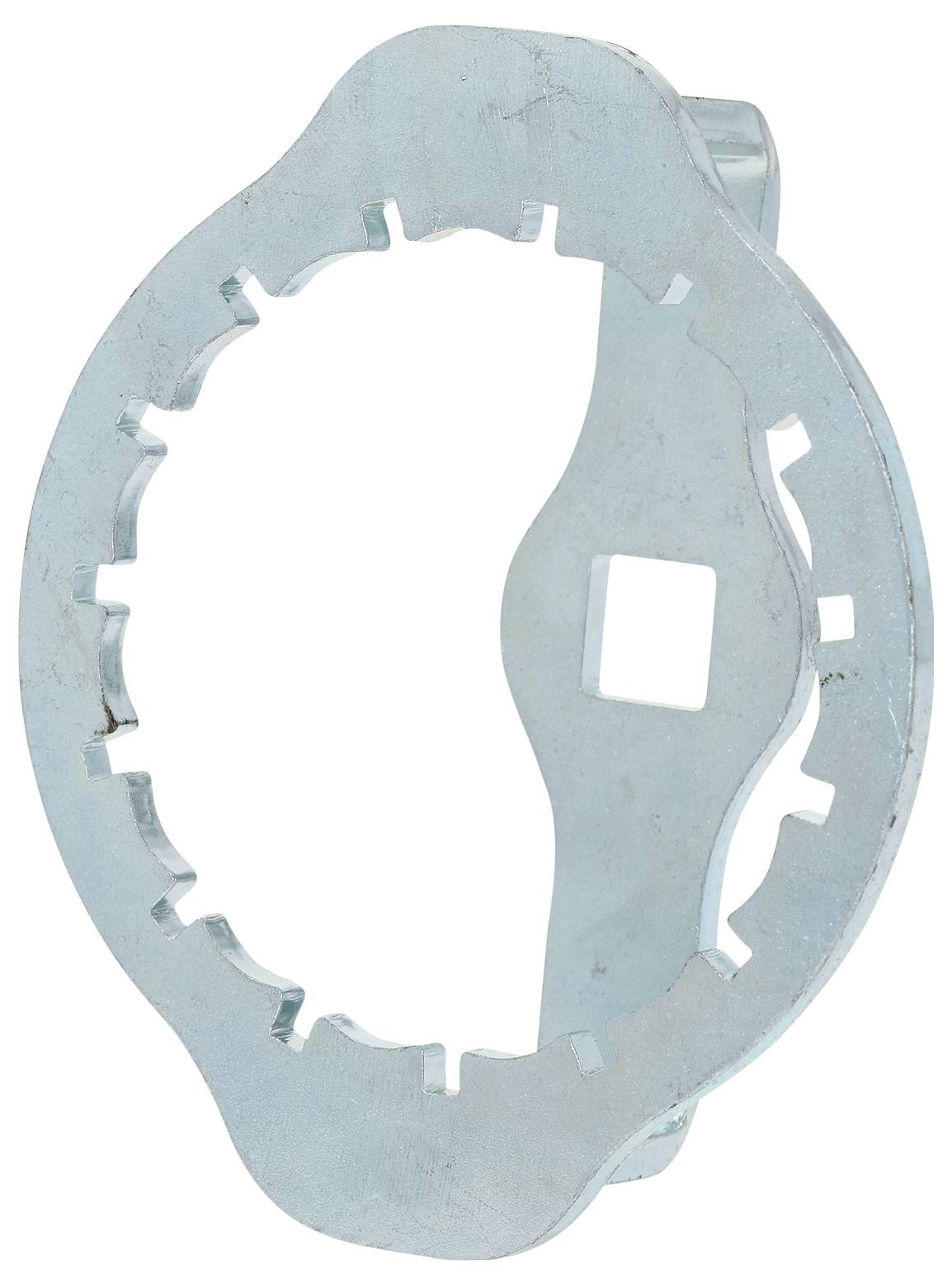 Egy fémből készült kulcstoldat, amely kör alakú, és élén több bevágással rendelkezik, amelyet egy adott típusú alkatrész megfogására terveztek.