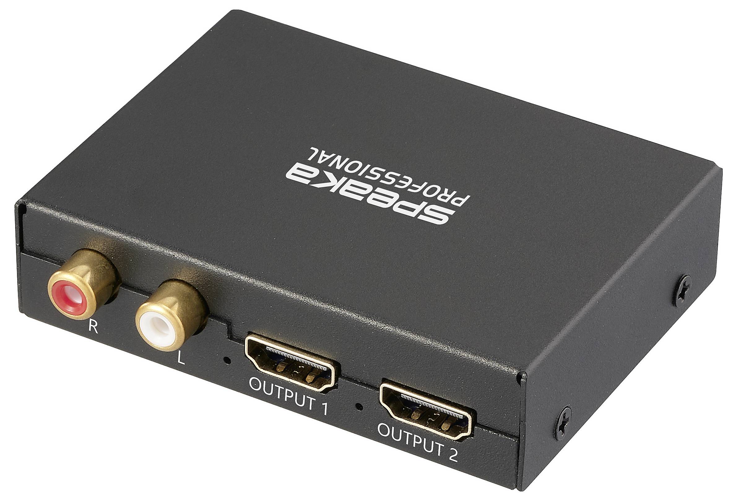 Egy kompakt fekete audiokonverter 'Speaka PROFESSIONAL' márkajelzéssel. Két HDMI kimenetet tartalmaz, amelyek 'OUTPUT 1' és 'OUTPUT 2' felirattal vannak ellátva, valamint RCA csatlakozókkal, amelyeken 'R' és 'L' szerepel.