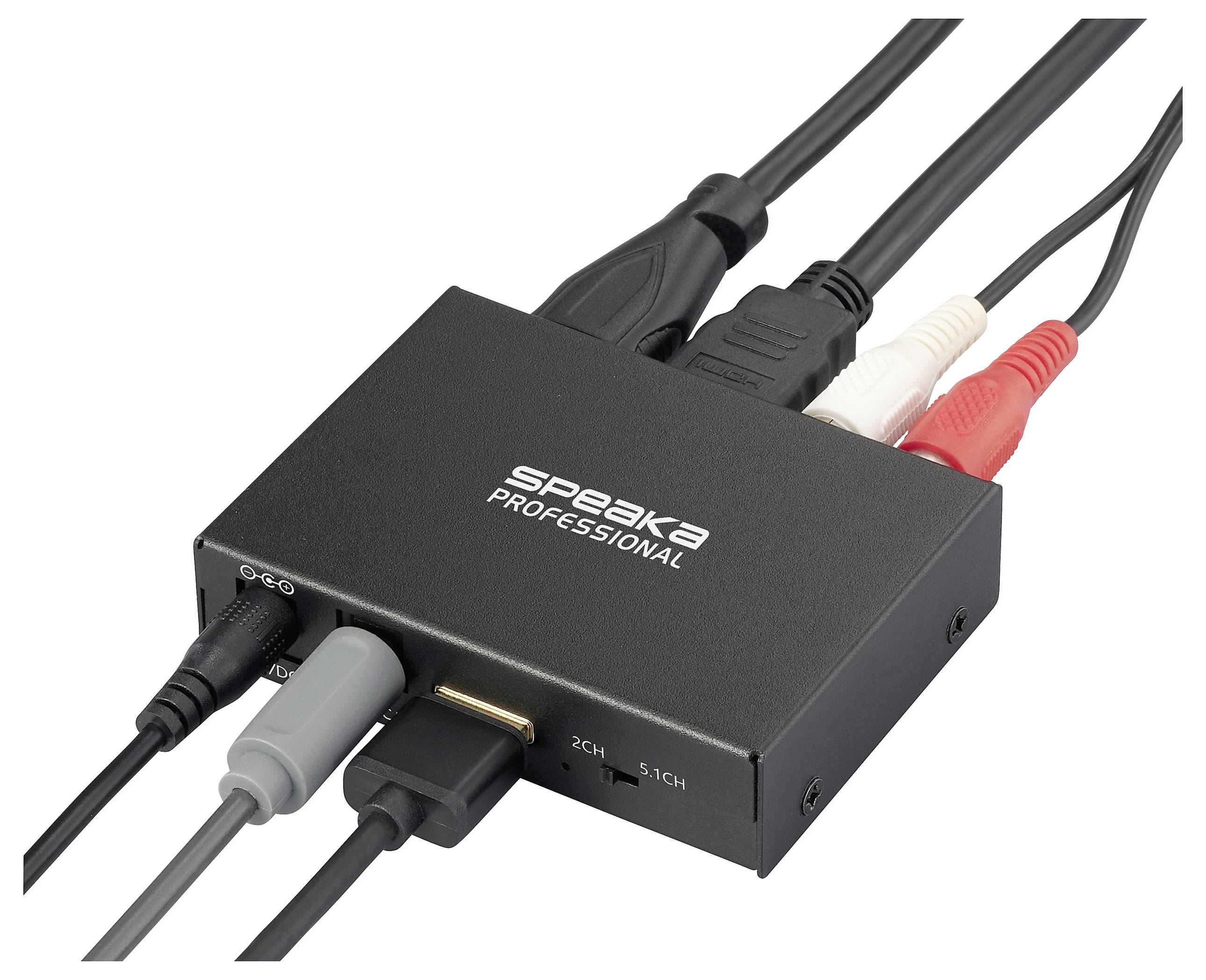 Egy fekete audió konverter több csatlakozókábellel, 'Speaka Professional' felirattal, amely 2-csatornás és 5.1-csatornás hang közötti konvertálásra szolgál.