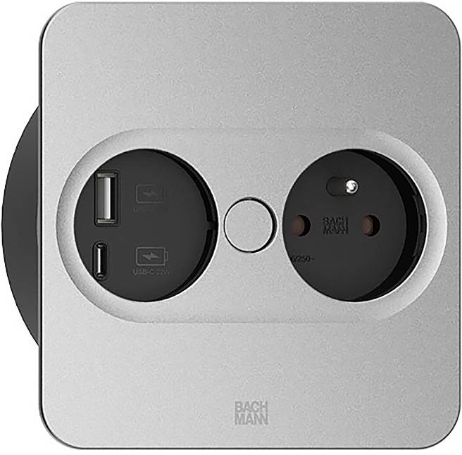 Egy négyzet alakú falicsatlakozó egy USB-C porttal, egy USB-A porttal és egyetlen elektromos csatlakozóval rendelkezik. A kialakítás kompakt és modern.