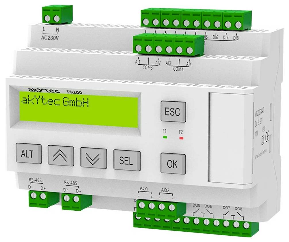 Egy digitális vezérlőkészülék több zöld porttal, egy kijelzővel, amelyen az 'akytec GmbH' felirat látható, valamint navigációs és kiválasztó gombokkal.