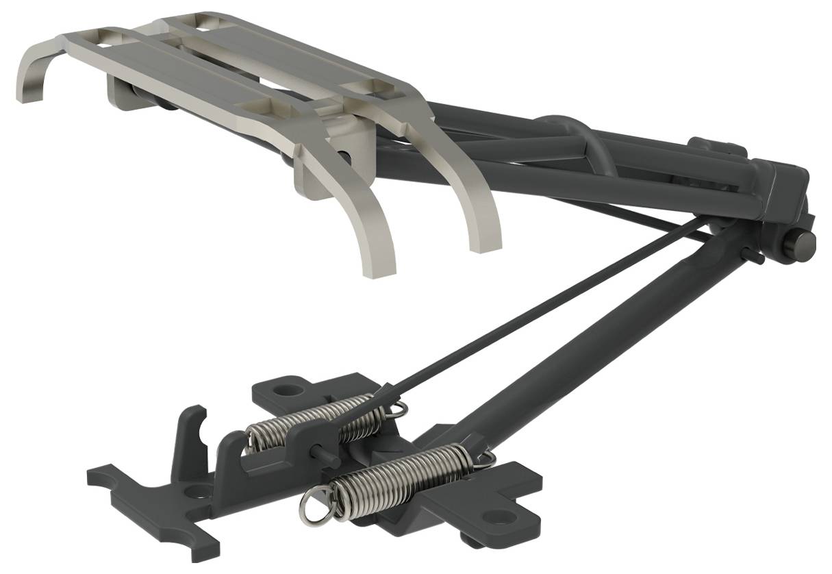 Egy fémrugókkal és emelőkarokkal rendelkező mechanikai eszköz, valószínűleg sí-kötésrendszer része, oldalnézetből látható.