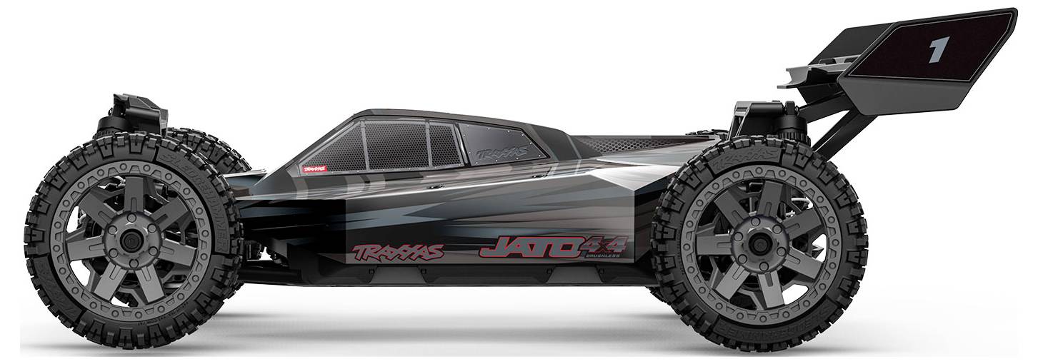 Egy fekete és szürke távirányítós autó nagy, durva terepjáró kerekekkel és hátsó légterelővel, amely a 'Jato 3.3' feliratot viseli, oldalról nézve.