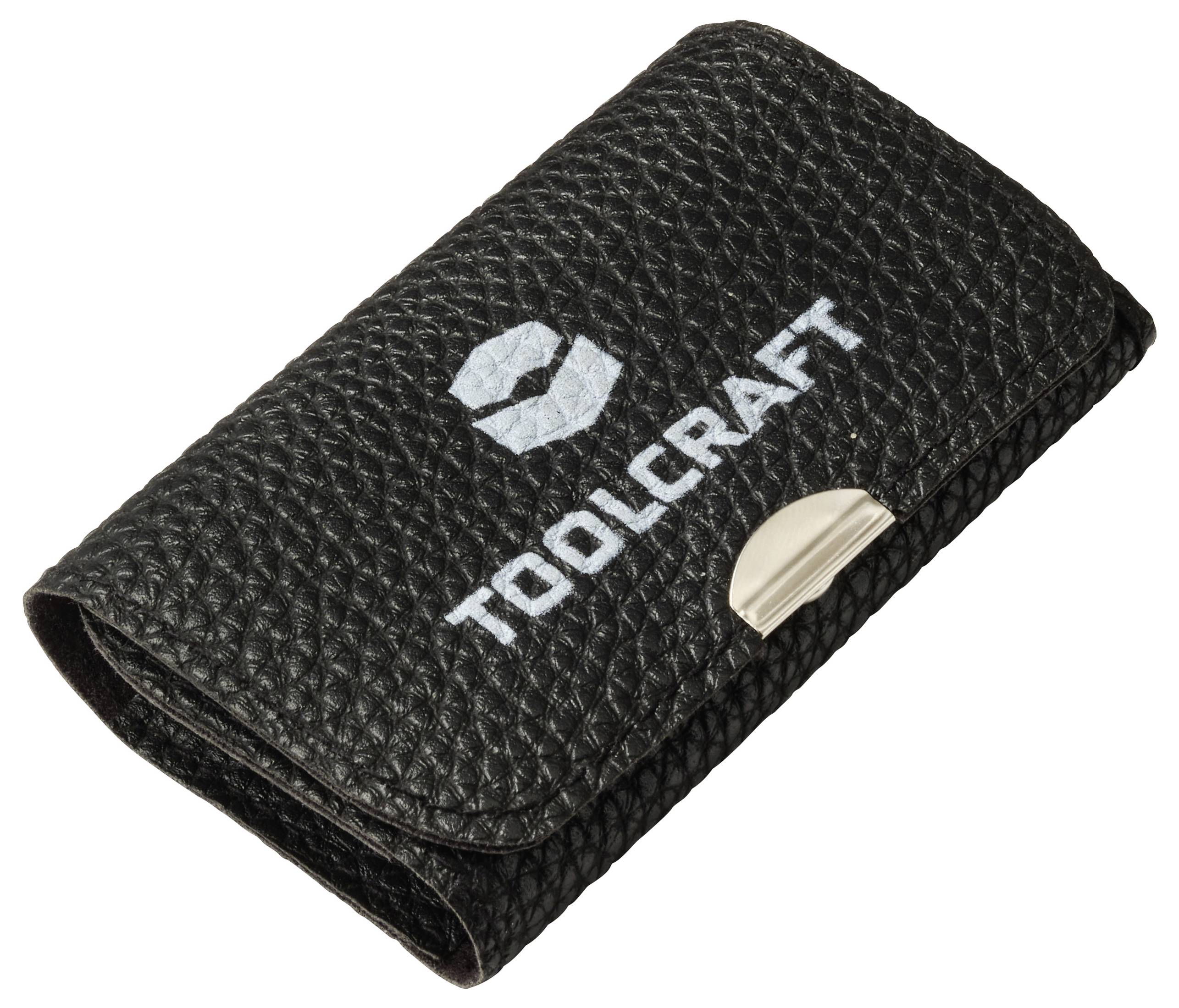 Fekete textúrált táska "TOOLCRAFT" logóval és fém kapoccsal az elején.