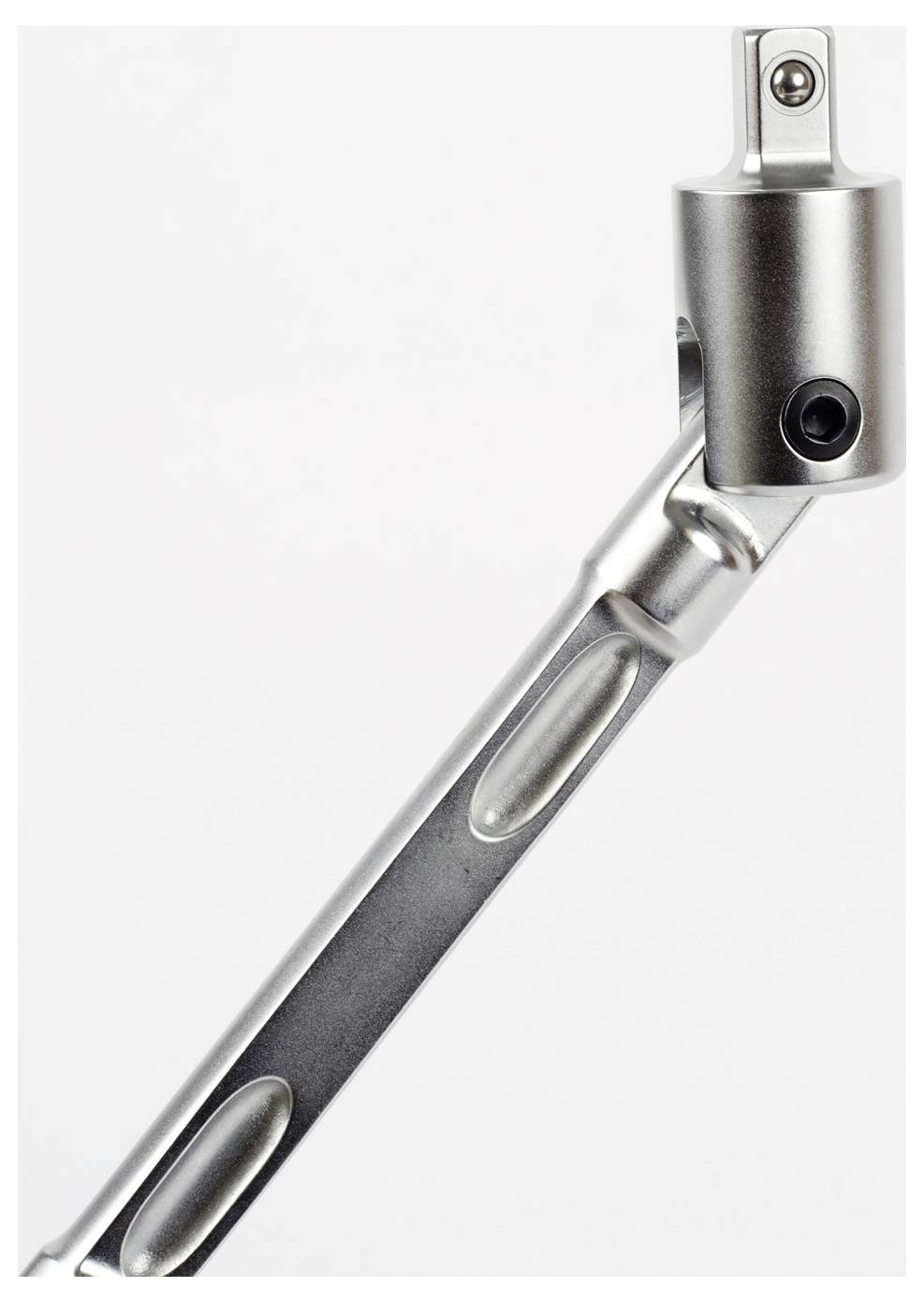 Egy fém szerszám közeli képe, amely csuklós karral és téglalap alakú fogantyúval rendelkezik, a csukló és a szokka illesztésének részleteit mutatva.