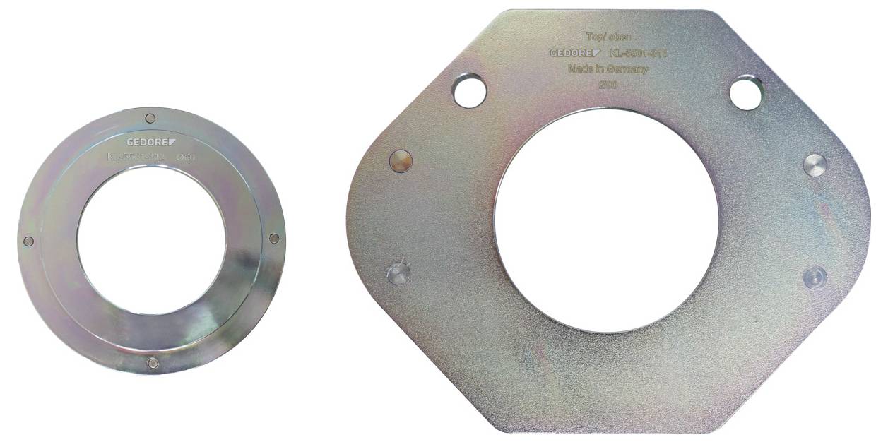 "Két kerek fém karimanyó; a bal oldali kisebb, a jobb oldalon nyolcszögletű szegély található a felső rész közelében a „Type Key: BEARING" szöveggel."