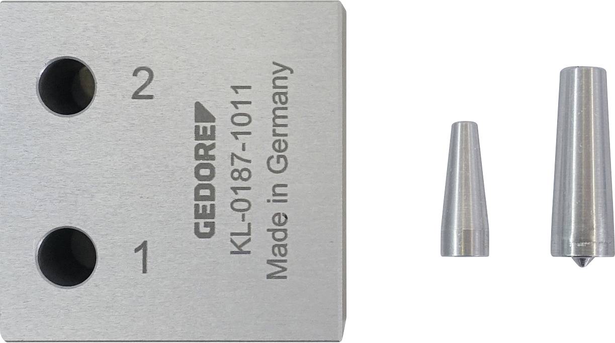Fémblokk két lyukkal, amelyek az „1" és „2" felirattal vannak jelölve, a „GEDORE KL-0187-1011 Made in Germany" felirattal, mellett két fémkúp.