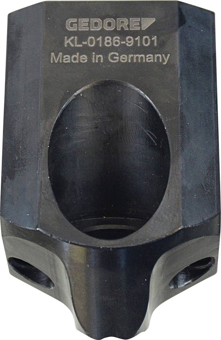 Egy fémszerszám alkatrész bevésett szöveggel 'GEDORE KL-0186-9101 Made in Germany'. Az alkatrésznek hengeres üregnyílása van és ipari megjelenésű.