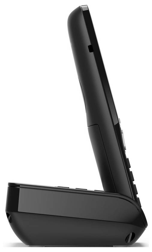 Egy vezeték nélküli telefon, amely egy töltőalkalmazottban pihen, oldalról nézve, kiemeli annak elegáns fekete dizájnját.