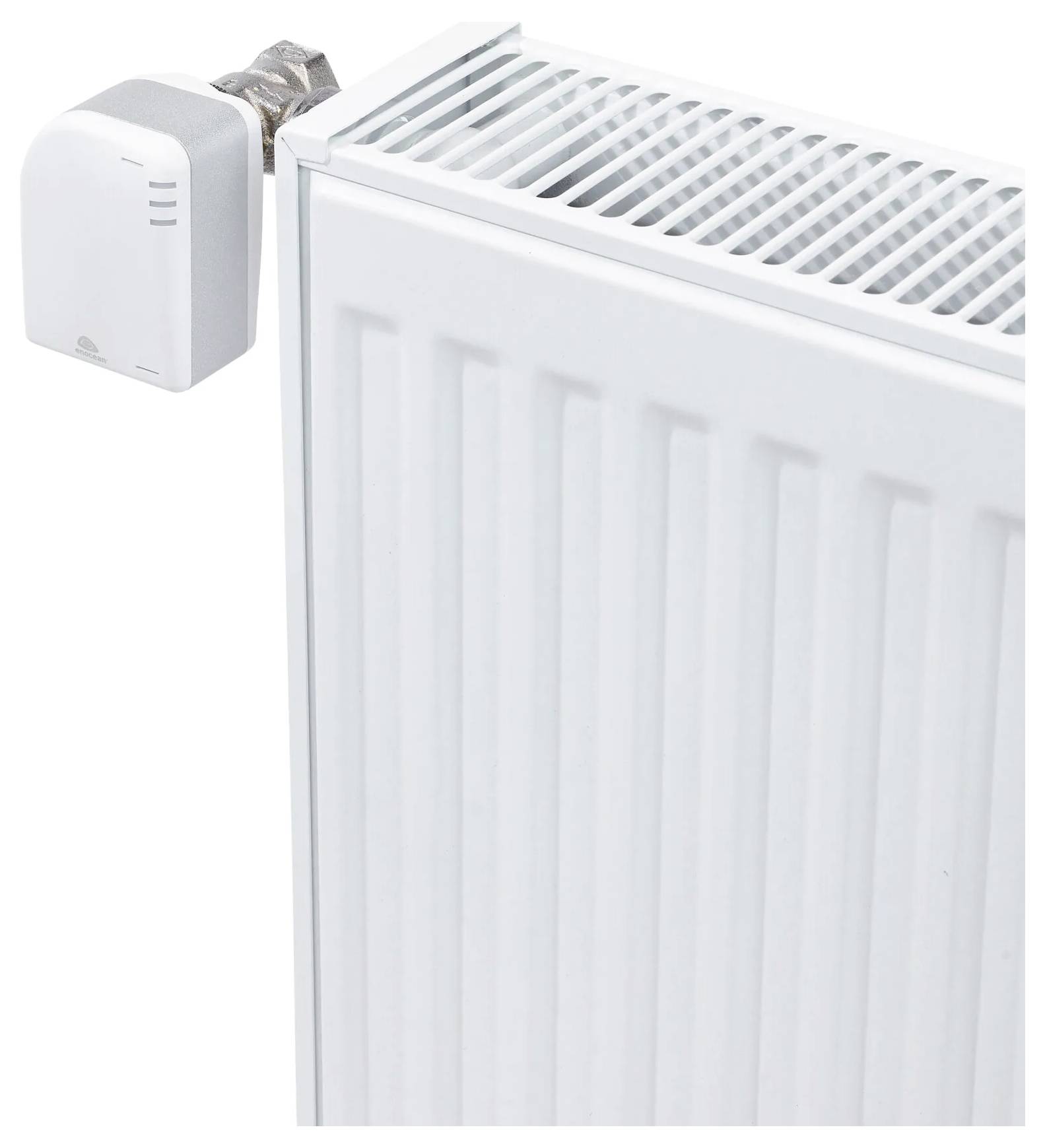 Termosztatikus radiátor szelep egy fehér radiátoron felszerelve, amely szabályozza a fűtés hőmérsékletét.
