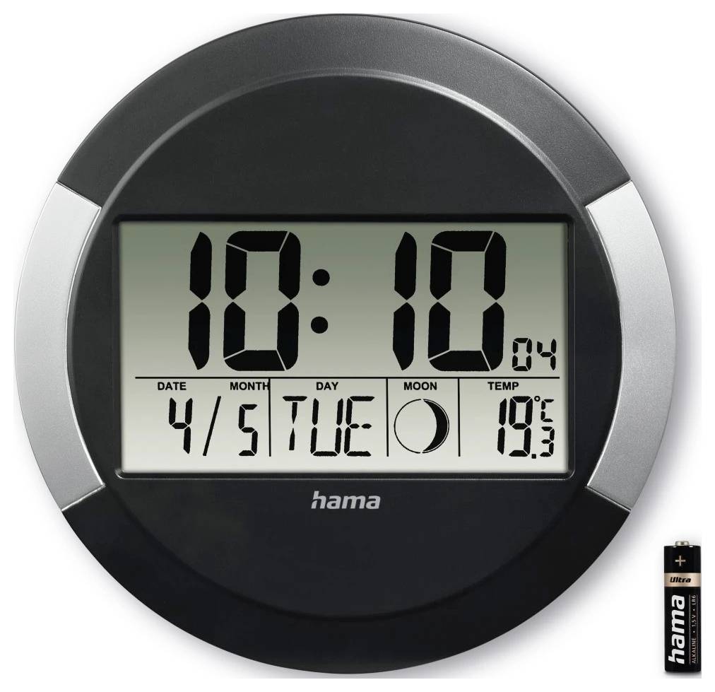 Kerek digitális fali óra, amely 10:10-et mutat, 4/5 (április 5.) kedd dátummal, holdphase ikonnal és 19,3°C hőmérséklettel; akkumulátor látható a méretarányhoz.