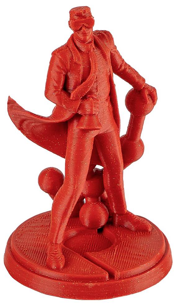 Piros 3D nyomtatott figura egy öltönyt viselő férfiról napszemüveggel és botot tartó pózban, kerek talapzaton elhelyezve