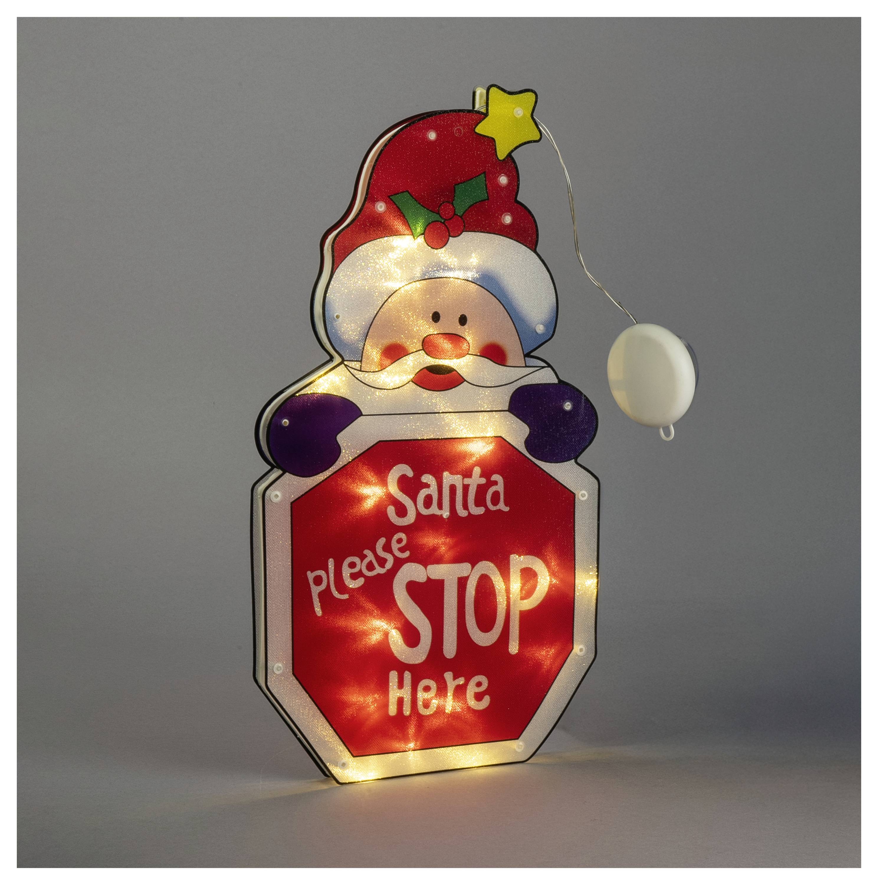 Santa alakú megvilágított stópjelzés piros „Santa kérlek ÁLLJ meg itt" üzenettel és egy húzószallaggal a jobb oldalon.