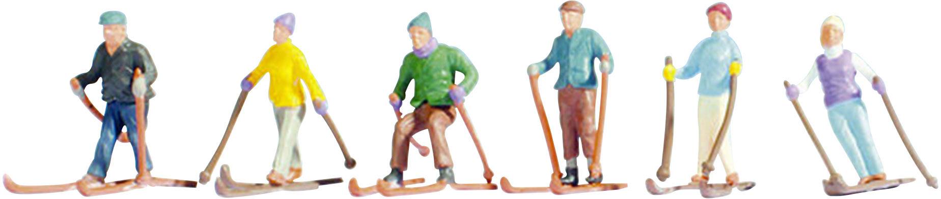 Hat síelő miniatűr figura egy csoportot alkot, mindegyik más-más öltözetben és különböző testtartásban ábrázolva a sípályán.