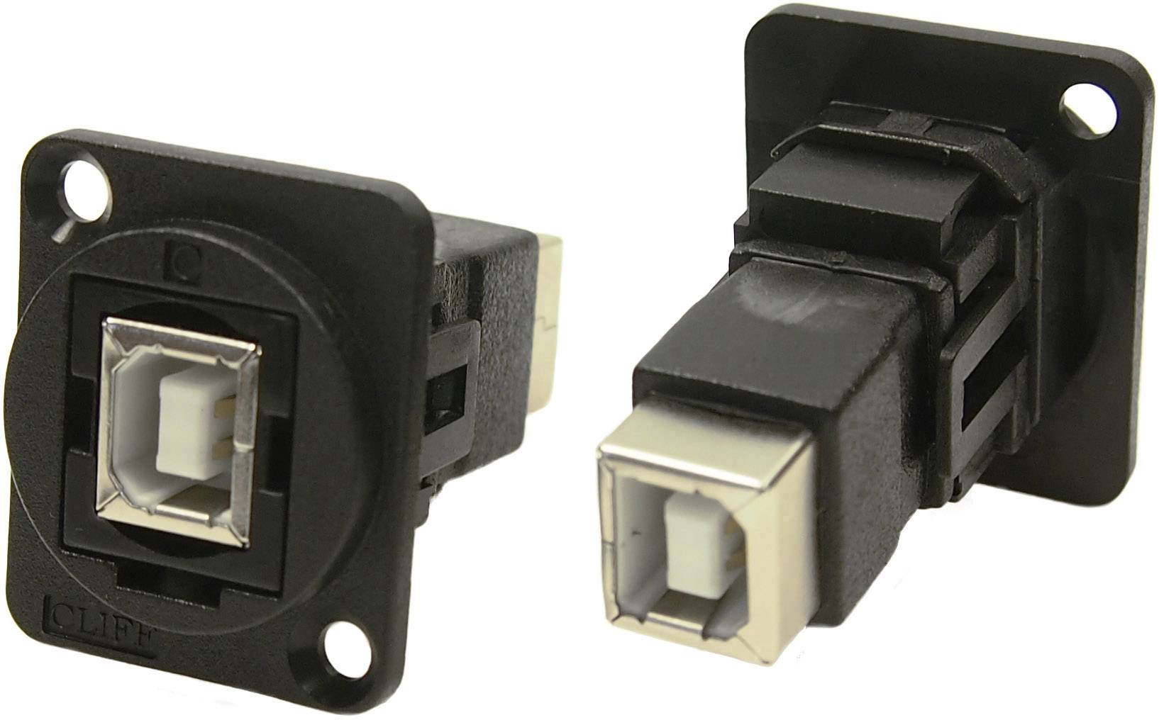 Két fekete USB-B aljzat négyzet alakú fémházban, téglalap alakú műanyag lemezekre szerelve, egymáshoz képest szöget bezárva.