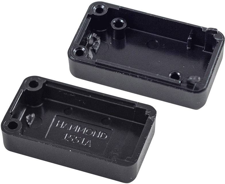 Két fekete műanyag alkatrész egy téglalap alakú elektronikai házból, csavarnyílásokkal és a 'HAMMOND 1551A' felirattal.