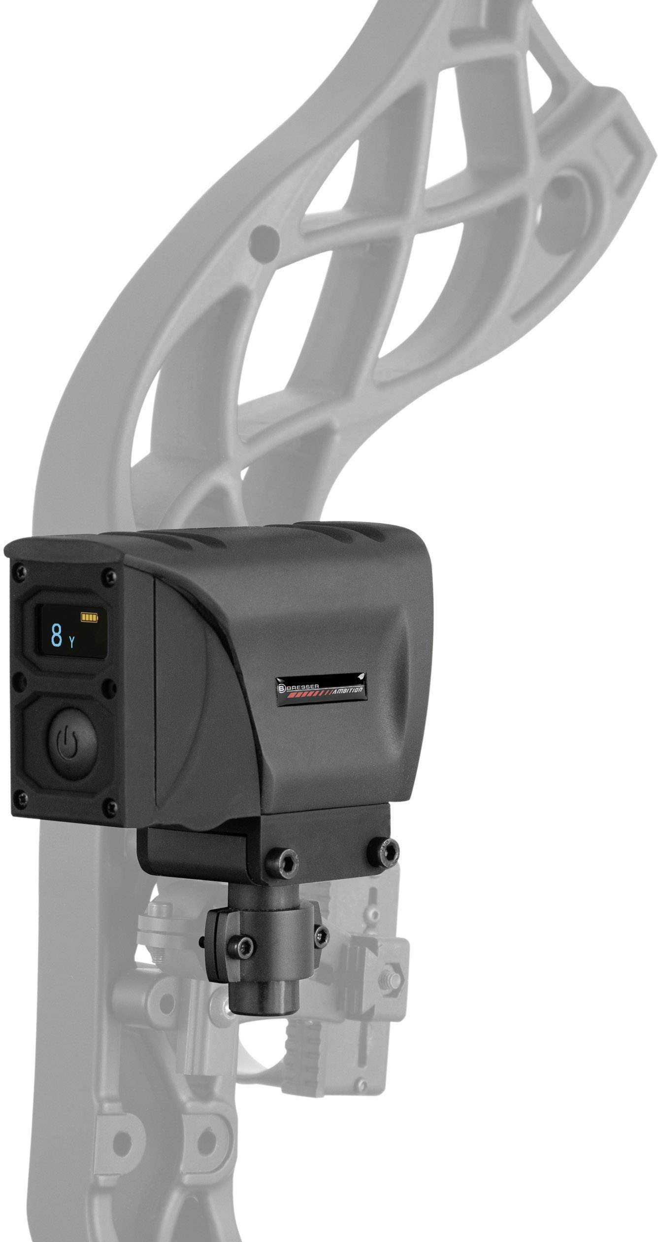 Egy fekete elektronikai alkatrész, valószínűleg egy mérő- vagy beállítóeszköz, egy szürke, strukturált fémrészre szerelve.