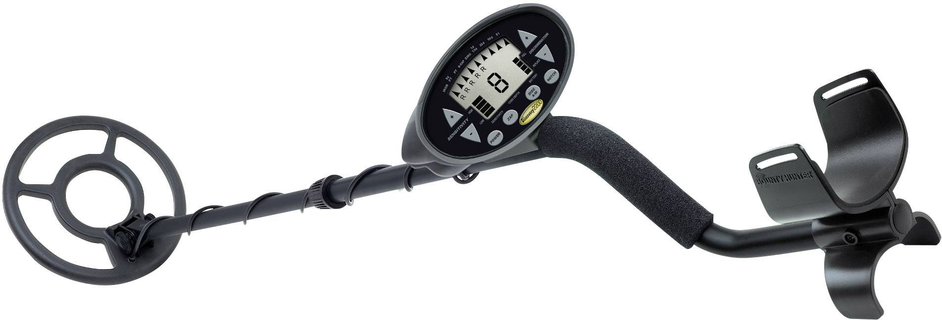 Egy kézben tartható fémkereső készülék digitális kijelzővel és köralakú keresőtekerccsel, amely alkalmas fémtárgyak felderítésére a talajban.