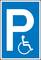 Mozgássérültek számára fenntartott parkolóhelyet jelző tábla, amelyen kerekesszék szimbólum látható.