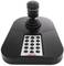Fekete botkormány numerikus billentyűzettel biztonsági rendszerek vezérléséhez, szám- és funkciógombokkal.