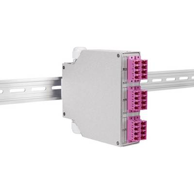 Egy szürke elektronikai modul rózsaszín csatlakozókkal van felszerelve egy fémső sínre. Két sorban, soronként hat csatlakozóval rendelkezik.