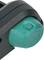 Zöld, kerek nyomógomb fekete műanyag házban, amely valószínűleg egy elektronikai vagy mechanikai eszköz része.