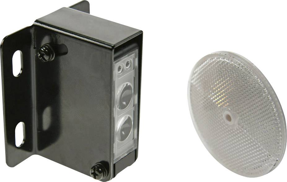 Egy fekete érzékelőház egy kerek, fényvisszaverő tükör mellett. Az érzékelőnek két lencséje van, és felismerésre lett tervezve.