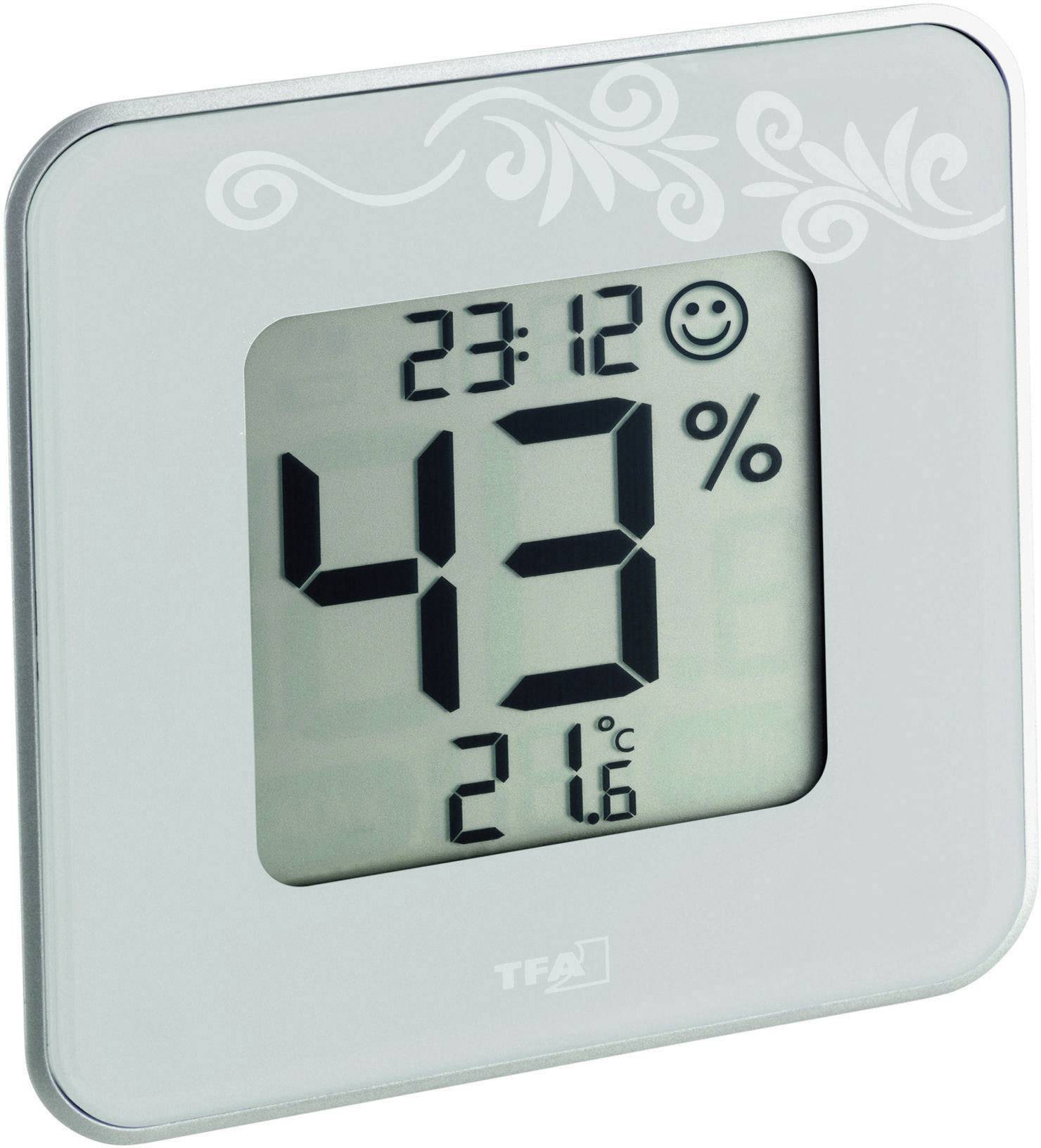 Digitális higrométer 43%-os páratartalmat, 21,6°C hőmérsékletet és 23:12 időpontot mutat. A mosolygó arc szimbólum kellemes körülményeket jelez.