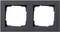 Egy téglalap alakú, dupla keret két négyzet alakú nyílással, kapcsolók vagy dugaljak részére, sötét színben.