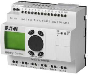 Controller industriale con display verde e tastiera numerica. Nome del marchio e vari connettori visibili.