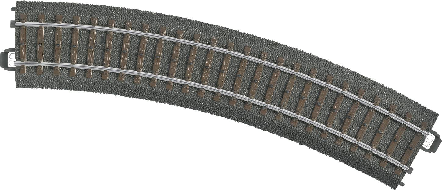 Binario ferroviario in miniatura in una curva, composto da un letto di ballast grigio scuro e traversine marroni, con rotaie argentate in cima.