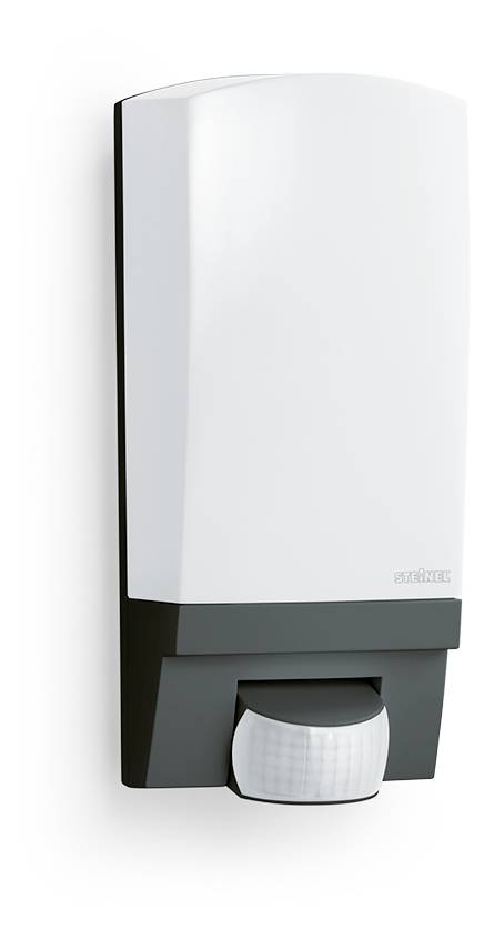 Dispenser di sapone automatico montato a parete di colore bianco con base scura e ugello sensore nella parte inferiore.