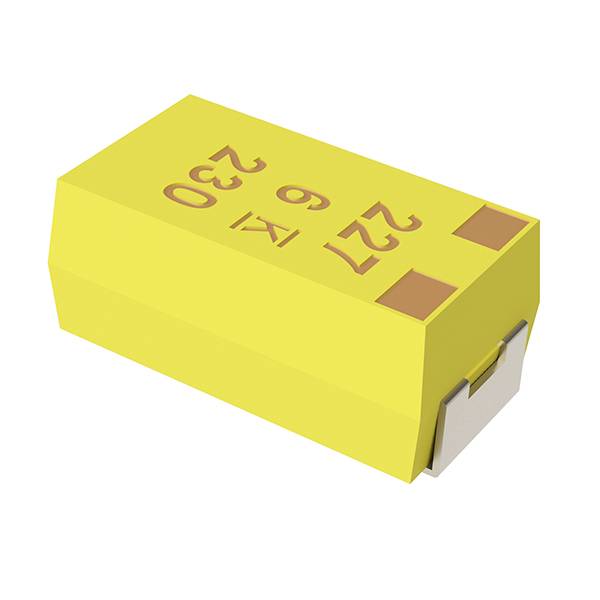 Condensatore elettrico giallo con la scritta '22 63 V'. Forma rettangolare con due terminali sulla parte superiore.