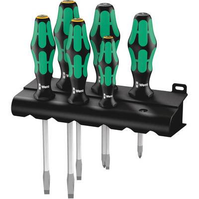 Sei cacciaviti verdi e neri con impugnature ergonomiche su un supporto nero, per un ordinato stoccaggio.