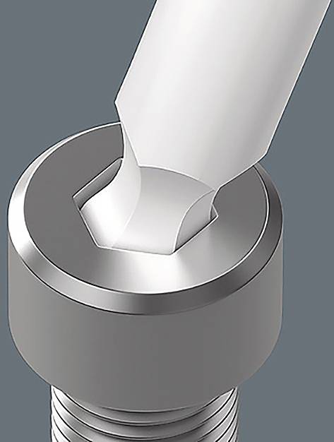 Cacciavite che si aggancia a una testa di vite esagonale su uno sfondo grigio, che illustra l'adattamento e la funzionalità di un utensile di precisione.