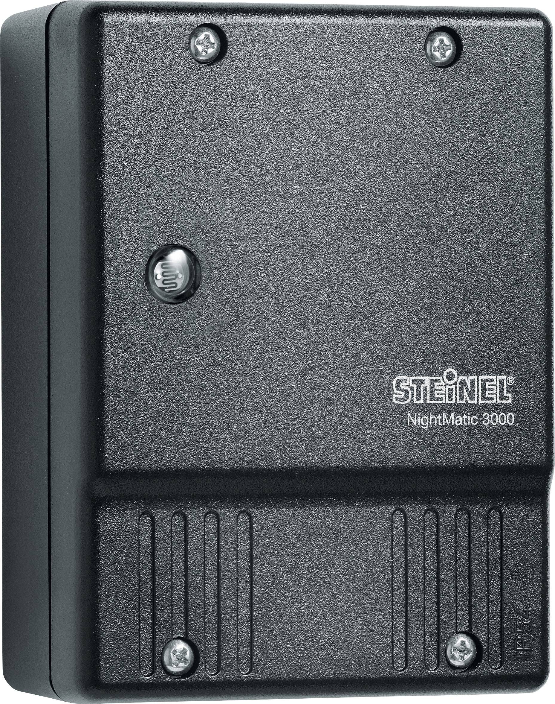 Componente elettrica nera con scritto 'STEINEL NightMatic 3000', fissata con diverse viti sulla parte anteriore.