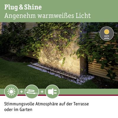 'Plug & Shine' Illuminazione esterna con luce color bianco caldo, illumina un muro di pietra ricoperto di piante. Ideale per terrazza o giardino.